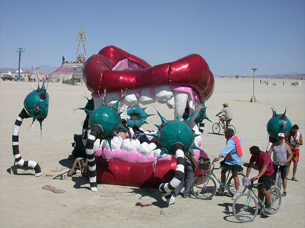 Bed in Your head at Burning Man 2005 with Man in background